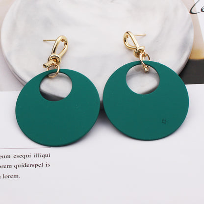 Female round face with circle earrings