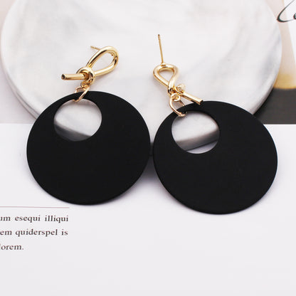Female round face with circle earrings